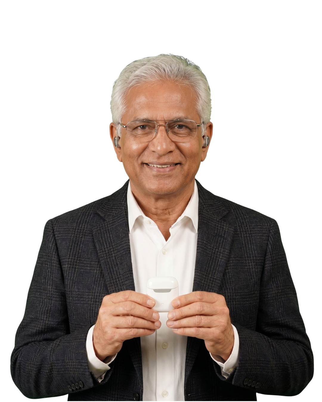 A happy Prudent Hearing patient holding a rechargeable hearing aid
